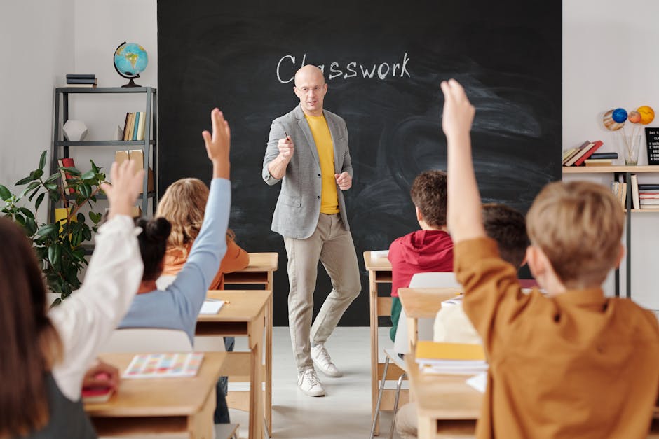 Teacher interacting with students raising hands in a classroom setting